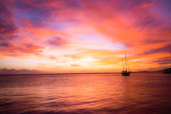 After the sun disappeared below the horizon, the sky changed the color to dramatic purple-red over the ocean in Bonaire.