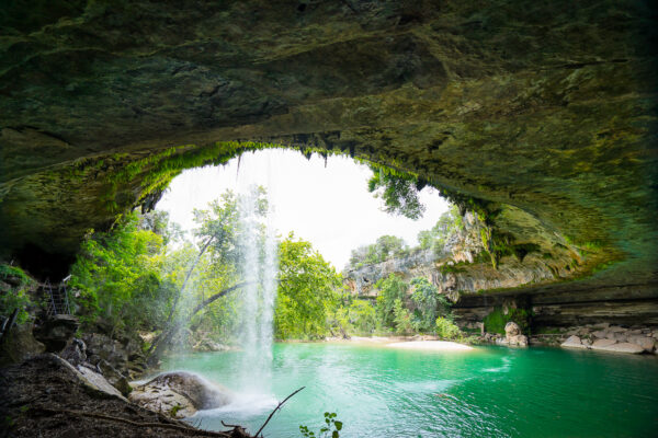 The summer colors decorate the Hamilton Pool, one of the most popular swimming holes near Austin, Texas.