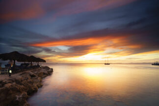A boat was surrounded by soft sunset light on a cool summer day in Bonaire, Dutch Caribbean.