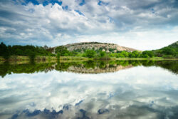 Thick clouds started to clear the sky at Enchanted Rock State Natural Area in Fredericksburg, Texas.