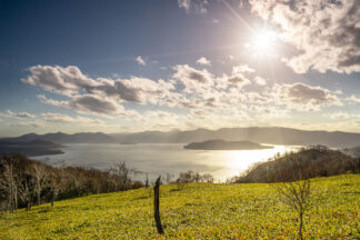 The afternoon sun casted its soft golden light over Lake Kussharo, the largest caldera lake in Hokkaido, Japan.