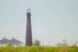 Bolivar Point Lighthouse in Port Bolivar, Texas on a hazy cloudy day.