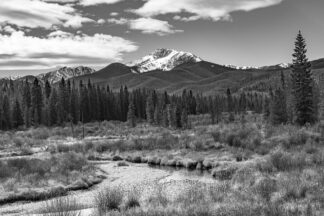 Snowy Byers Peak overlooks a meadow of late autumn colors near Fraser, Colorado.