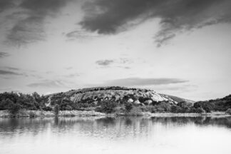 Soft evening light illuminated Enchanted Rock and Moss Lake during the twilight hours in Fredericksburg, Texas, in the heart of Hill Country.